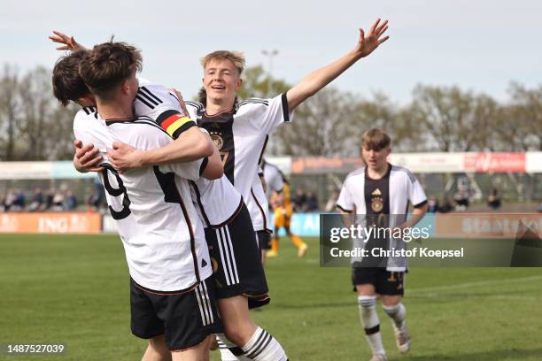 Christian Prenaj of Germany celebrates the third goal with Alexander Staff and Leopold Schmid during the international friendly match between U15...