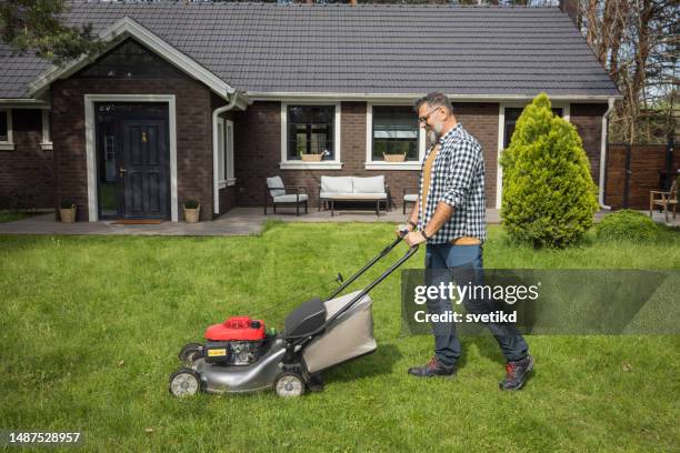 weekend activities - man mowing lawn stock pictures, royalty-free photos & images