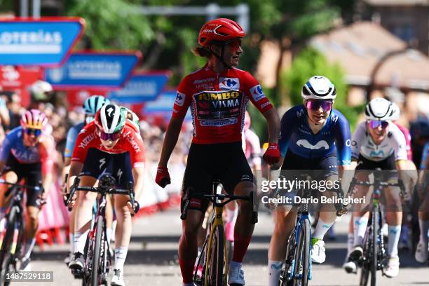 Marianne Vos of The Netherlands and Team Jumbo-Visma - Red Leader Jersey celebrates at finish line as stage winner Emma Norsgaard of Denmark and...