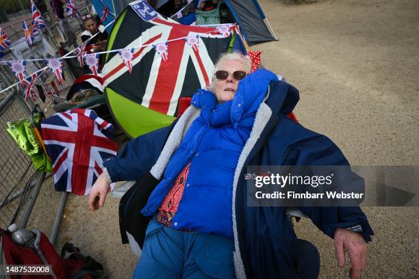 Woman sleeps on The Mall, on May 04, 2023 in London, England. The Coronation of King Charles III and The Queen Consort will take place on May 6, part...