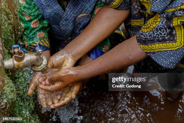 Children washing their hands in a village near Gicumbi, northern province, Rwanda.