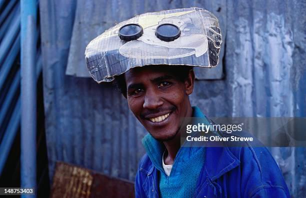 welder with home-made face mask. - asmara eritrea stock pictures, royalty-free photos & images