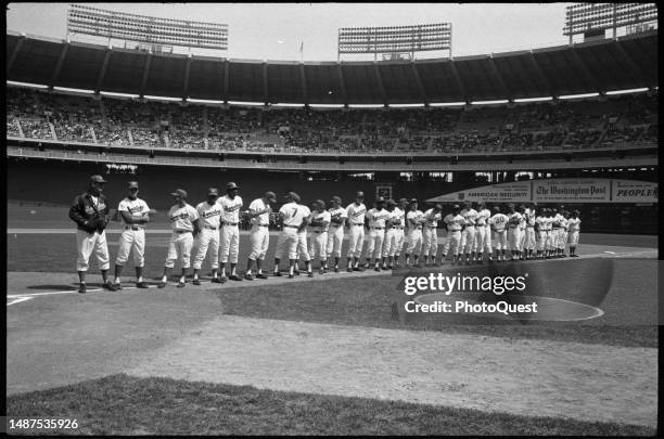 Members of the Washington Senators baseball team line up, along the 3rd base line, at Robert F Kennedy Stadium, Washington DC, April 5, 1971. Among...