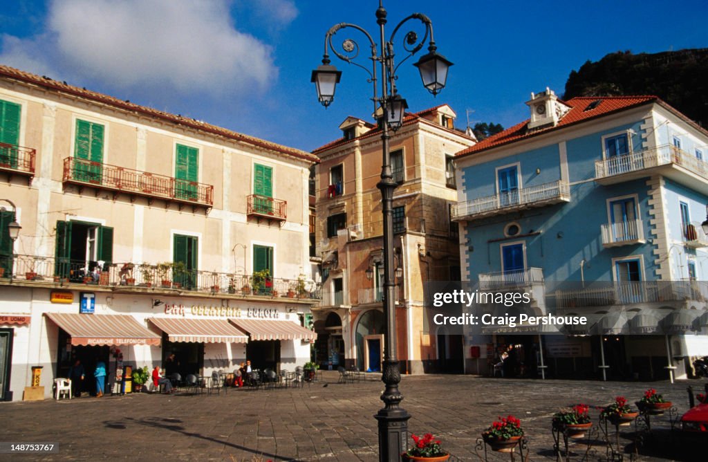 Colourful buildings and lamp post on main piazza.