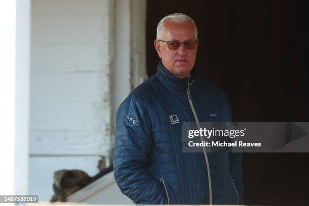 Trainer Todd Pletcher of Kingsbarns, Forte and Tapit Trice looks on during morning workouts in preparation for the 149th running of the Kentucky...