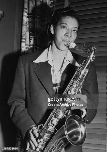 American tennis player Althea Gibson playing the saxophone, circa 1950.