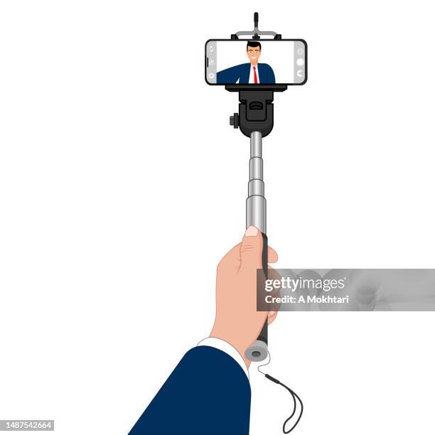 arm des jungen mannes im selfie. - selfie stick white background stock-grafiken, -clipart, -cartoons und -symbole