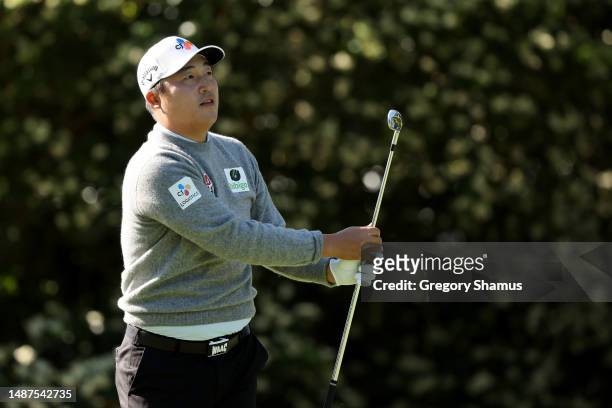 Kyoung-Hoon Lee of South Korea watches his shot from the sixth tee during the first round of the Wells Fargo Championship at Quail Hollow Country...