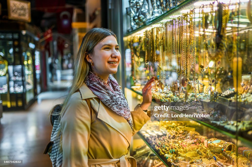 Woman looking at a jewelry store window