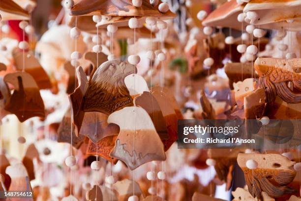 souvenirs displayed outside shop in oriental village shopping centre, pantai kok. - pantai kok stock pictures, royalty-free photos & images