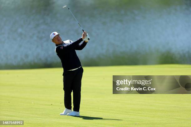 Sungjae Im of Korea plays an approach shot on the 15th hole during the first round of the Wells Fargo Championship at Quail Hollow Country Club on...