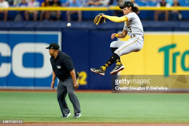 Ji Hwan Bae of the Pittsburgh Pirates attempts to field a ball during the first inning against the Tampa Bay Rays at Tropicana Field on May 04, 2023...