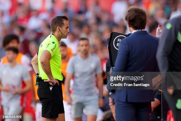 Referee Javier Alberola Rojas looks at the VAR screen after Bryan Gil of Sevilla FC scores the team's first goal during the LaLiga Santander match...