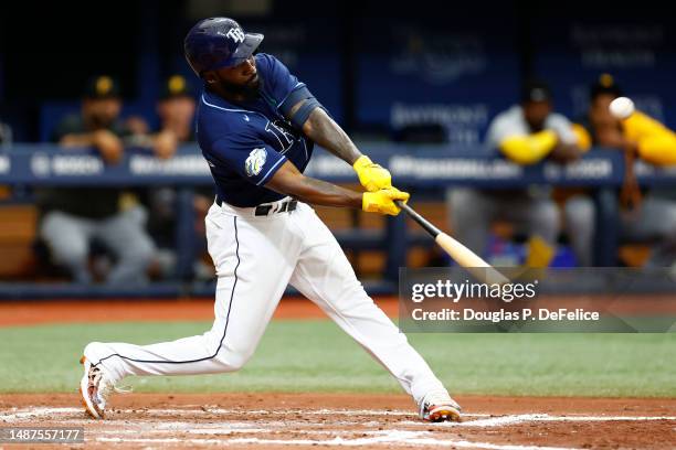 Randy Arozarena of the Tampa Bay Rays hits a solo home run during the fourth inning against the Pittsburgh Pirates at Tropicana Field on May 04, 2023...