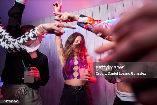 happy friends dancing together in a night club - drunk stock pictures, royalty-free photos & images