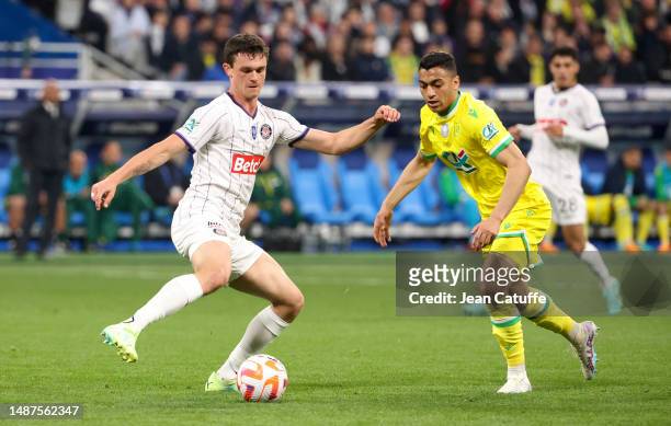 Rasmus Nicolaisen of Toulouse, Mostafa Mohamed of Nantes during the French Cup final between FC Nantes and Toulouse FC at Stade de France on April...