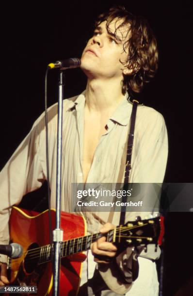 American Rock and Pop musician David Johansen plays acoustic guitar as he performs onstage at the Palladium, New York, New York, August 20, 1979.