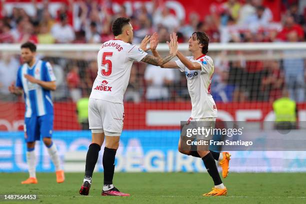 Lucas Ocampos of Sevilla FC celebrates with Bryan Gil after scoring the team's second goal from the penalty spot during the LaLiga Santander match...