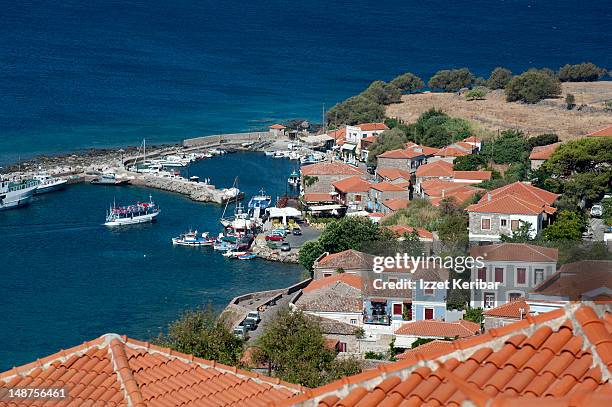 overview of molyvos fisihing port and village seen from castle. - mytilini stockfoto's en -beelden