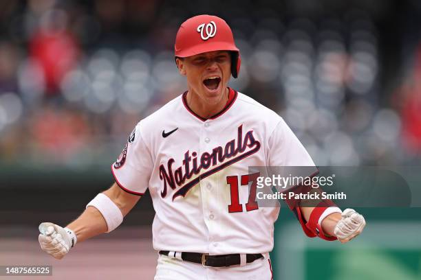 Alex Call of the Washington Nationals celebrates as he rounds the bases after hitting a walk-off home run against the Chicago Cubs during the ninth...