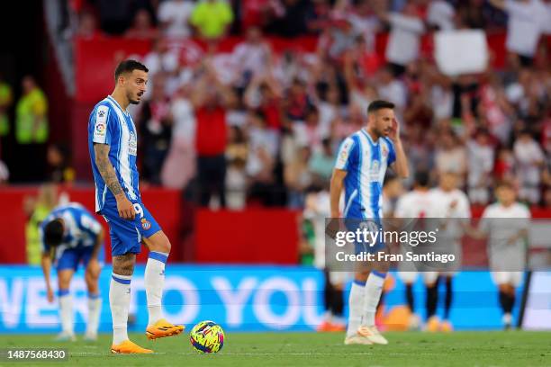 Joselu of RCD Espanyol looks dejected after Pape Gueye of Sevilla FC scores the team's third goal during the LaLiga Santander match between Sevilla...