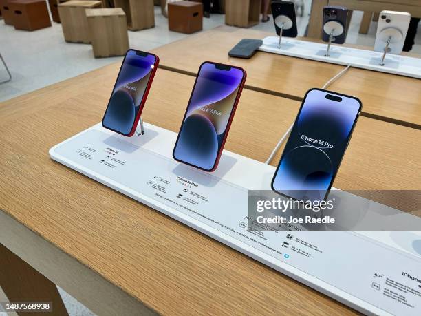 Apple phones on display in an Apple store on May 04, 2023 in Miami, Florida. Apple will report its fiscal Q2 earnings after the bell, and some...