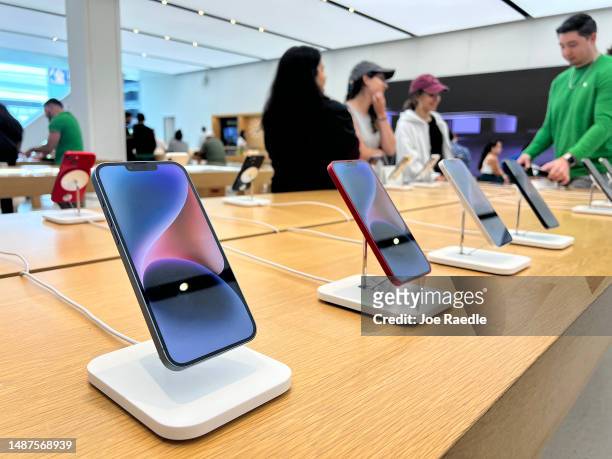 Apple phones on display in an Apple store on May 04, 2023 in Miami, Florida. Apple will report its fiscal Q2 earnings after the bell, and some...