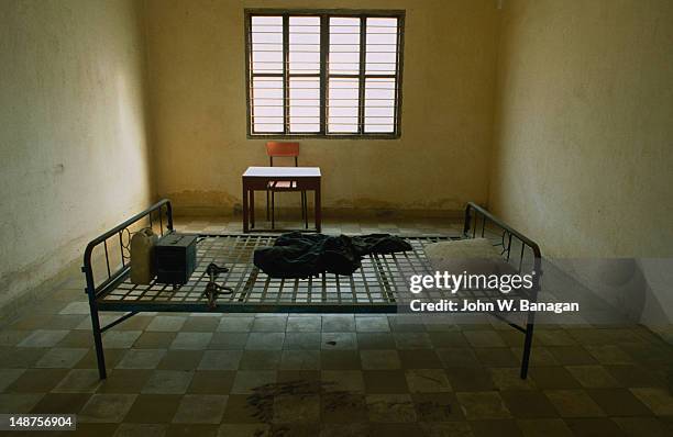 one of the torture rooms as it was found in 1979 at the infamous s-21 or tuol sleng museum in phnom penh. - cambodia genocide stock pictures, royalty-free photos & images