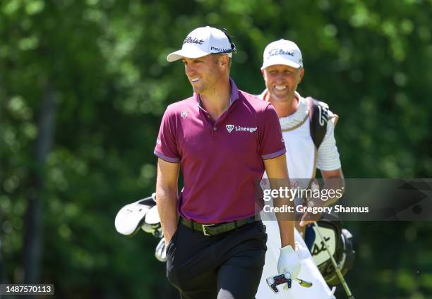 Justin Thomas of the United States and caddie Jim 'Bones' Mackay are seen on the eighth hole during the first round of the Wells Fargo Championship...