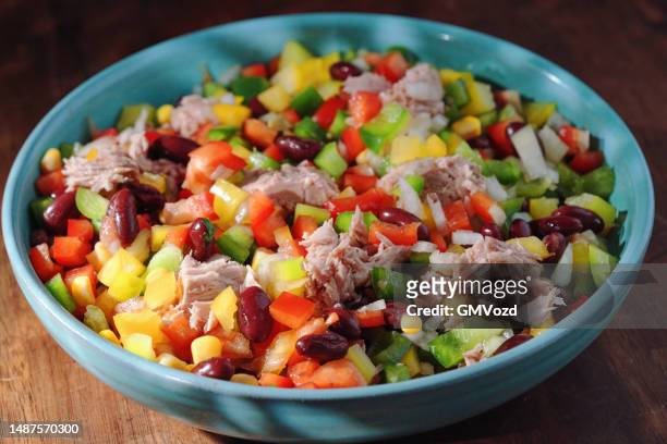 tuna salad with bell pepper, corn, onions, kidney beans and olives - seafood salad stock pictures, royalty-free photos & images