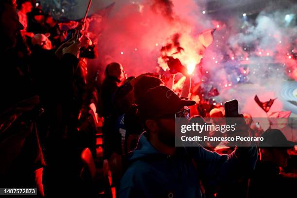 Fans of SSC Napoli celebrate their side's first goal scored by Victor Osimhen of SSC Napoli as they watch the Serie A match between Udinese Calcio...