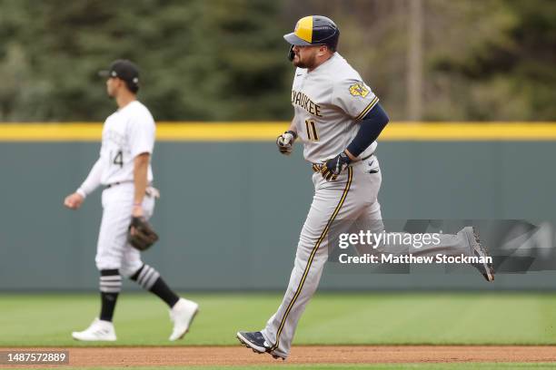 Rowdy Tellez of the Milwaukee Brewers circles the bases after hitting a solo home run against the Colorado Rockies in the first inning at Coors Field...