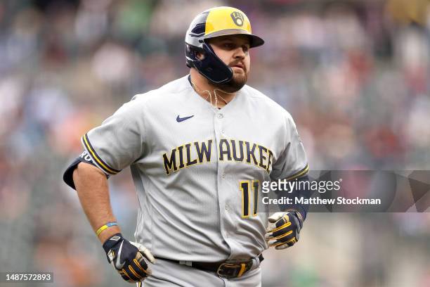 Rowdy Tellez of the Milwaukee Brewers circles the bases after hitting a solo home run against the Colorado Rockies in the first inning at Coors Field...