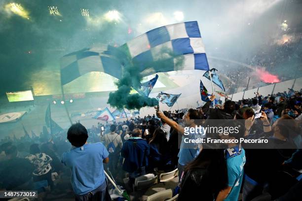 Fans of SSC Napoli celebrate their side's first goal scored by Victor Osimhen of SSC Napoli as they watch the Serie A match between Udinese Calcio...