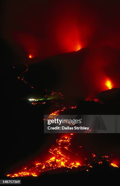 mt etna at her volcanic best, village of nicolosi in the lava path on the downhill track to catania. - mt etna fotografías e imágenes de stock