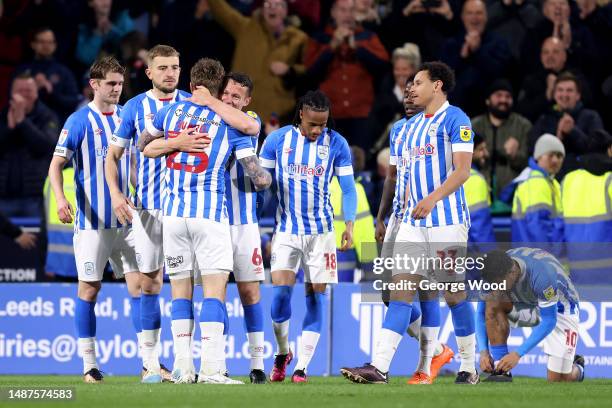 Danny Ward of Huddersfield Town celebrates with teammates after scoring the team's first goal during the Sky Bet Championship between Huddersfield...