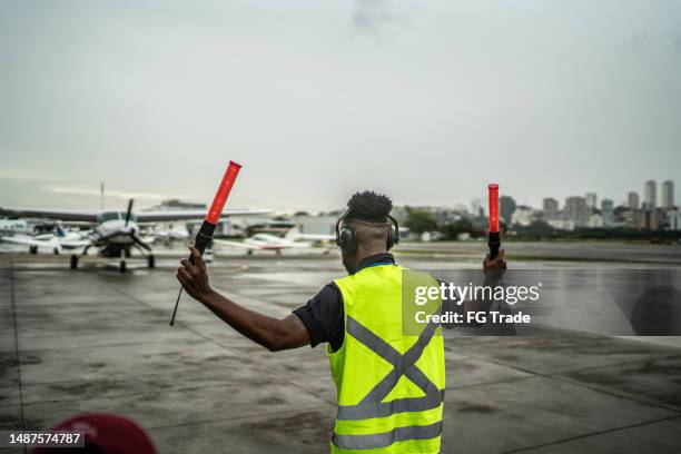 Plane Signalling 89 Marshalling Plane Stock Photos, High-Res Pictures, and Images ...