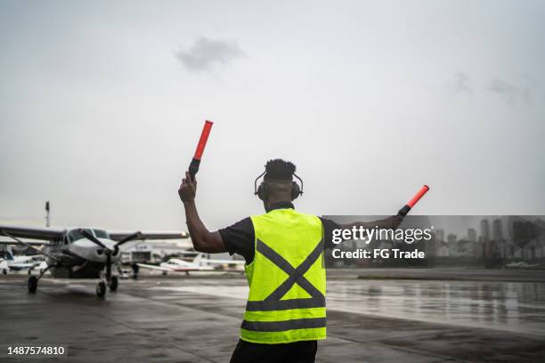 Plane Signalling 89 Marshalling Plane Stock Photos, High-Res Pictures, and Images ...