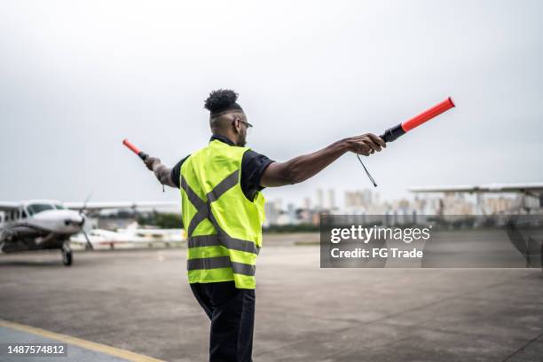 Plane Signalling 89 Marshalling Plane Stock Photos, High-Res Pictures, and Images ...