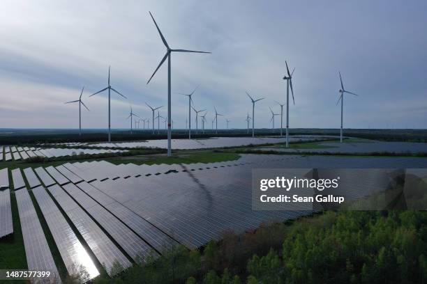 In this aerial view wind turbines spin at the Klettwitz Nord solar energy park on May 04, 2023 near Klettwitz, Germany. The German government is...