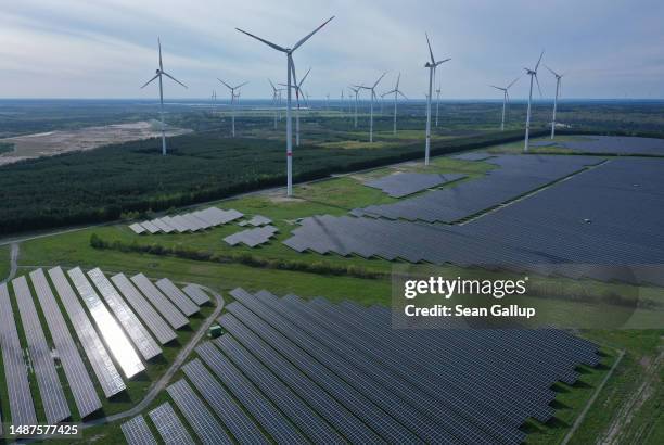 In this aerial view wind turbines spin at the Klettwitz Nord solar energy park on May 04, 2023 near Klettwitz, Germany. The German government is...