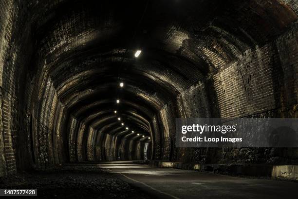 View inside the empty disused Cressbrook Tunnel on the Monsal Trail.