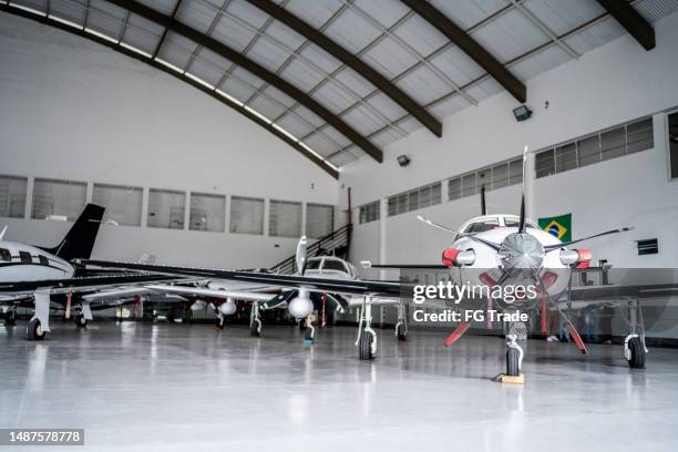 private airplanes in the airport hangar - airplane part stock pictures, royalty-free photos & images