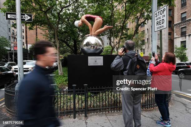 One of American artist Carole A. Feuerman's hyper-realistic sculptures of swimmers is displayed along Park Avenue on May 04, 2023 in New York City....