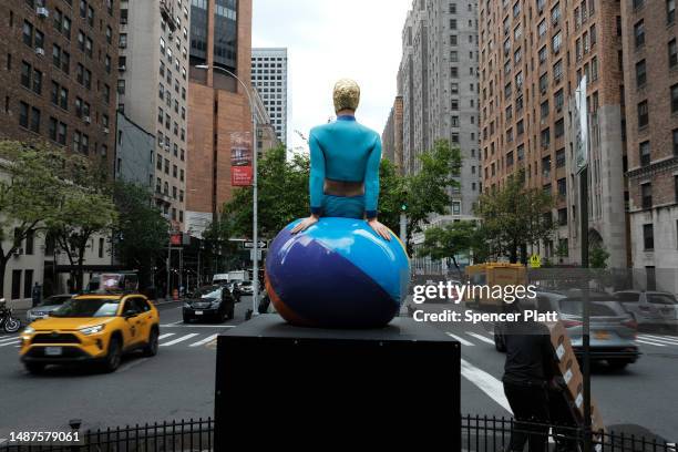 One of American artist Carole A. Feuerman's hyper-realistic sculptures of swimmers is displayed along Park Avenue on May 04, 2023 in New York City....