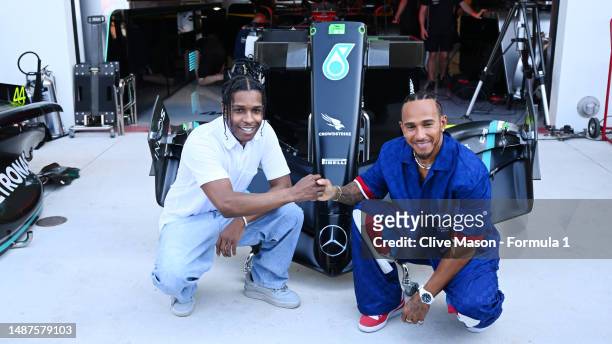 Lewis Hamilton of Great Britain and Mercedes poses for a photo with A$AP Rocky in the Paddock during previews ahead of the F1 Grand Prix of Miami at...