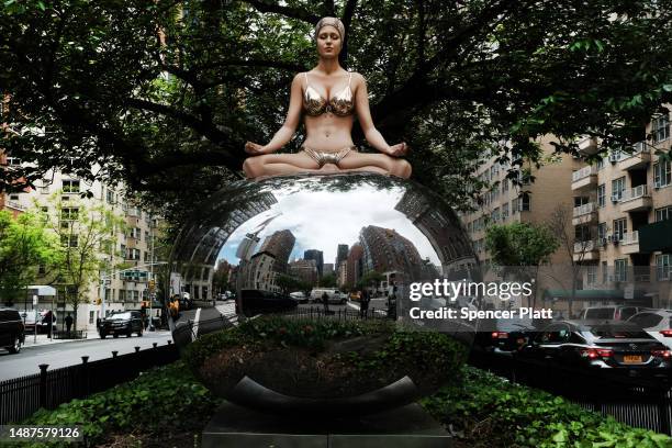 One of American artist Carole A. Feuerman's hyper-realistic sculptures of swimmers is displayed along Park Avenue on May 04, 2023 in New York City....