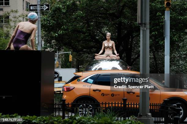 One of American artist Carole A. Feuerman's hyper-realistic sculptures of swimmers is displayed along Park Avenue on May 04, 2023 in New York City....