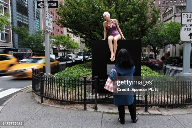 One of American artist Carole A. Feuerman's hyper-realistic sculptures of swimmers is displayed along Park Avenue on May 04, 2023 in New York City....