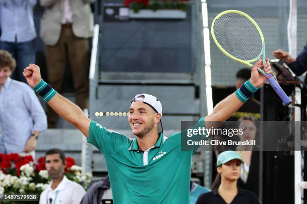 Jan-Lennard Struff of Germany celebrates after winning match point against Stefanos Tsitsipas of Greece during the Men's Quarter-Final match on Day...